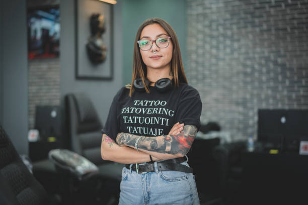 photo of tattoo artist standing in a shop