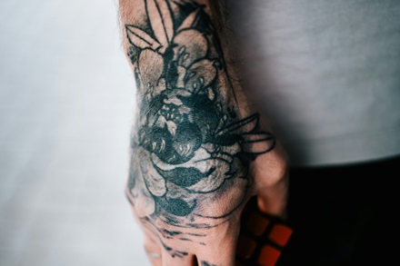 hand tattoo of a rose