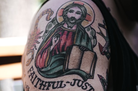 half sleeve of a traditional Jesus tattoo